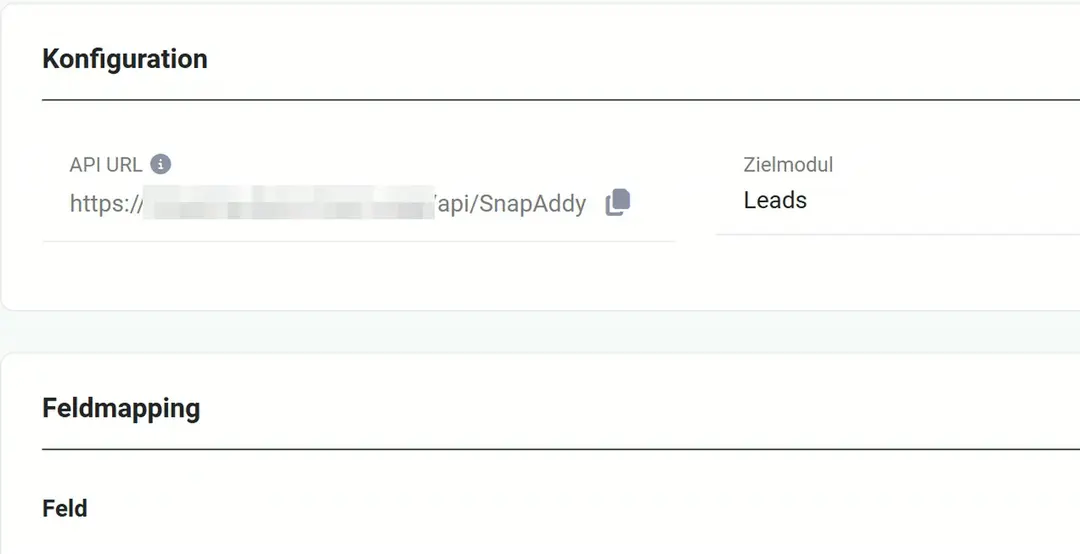 Block „Konfiguration“ mit dem Feld „API URL“ (Adresse teilweise unkenntlich) und Kopier-Symbol, daneben Zielmodul Leads